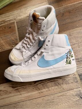 Nike White High-Top Sneakers with Light Blue Swoosh and Floral Detail